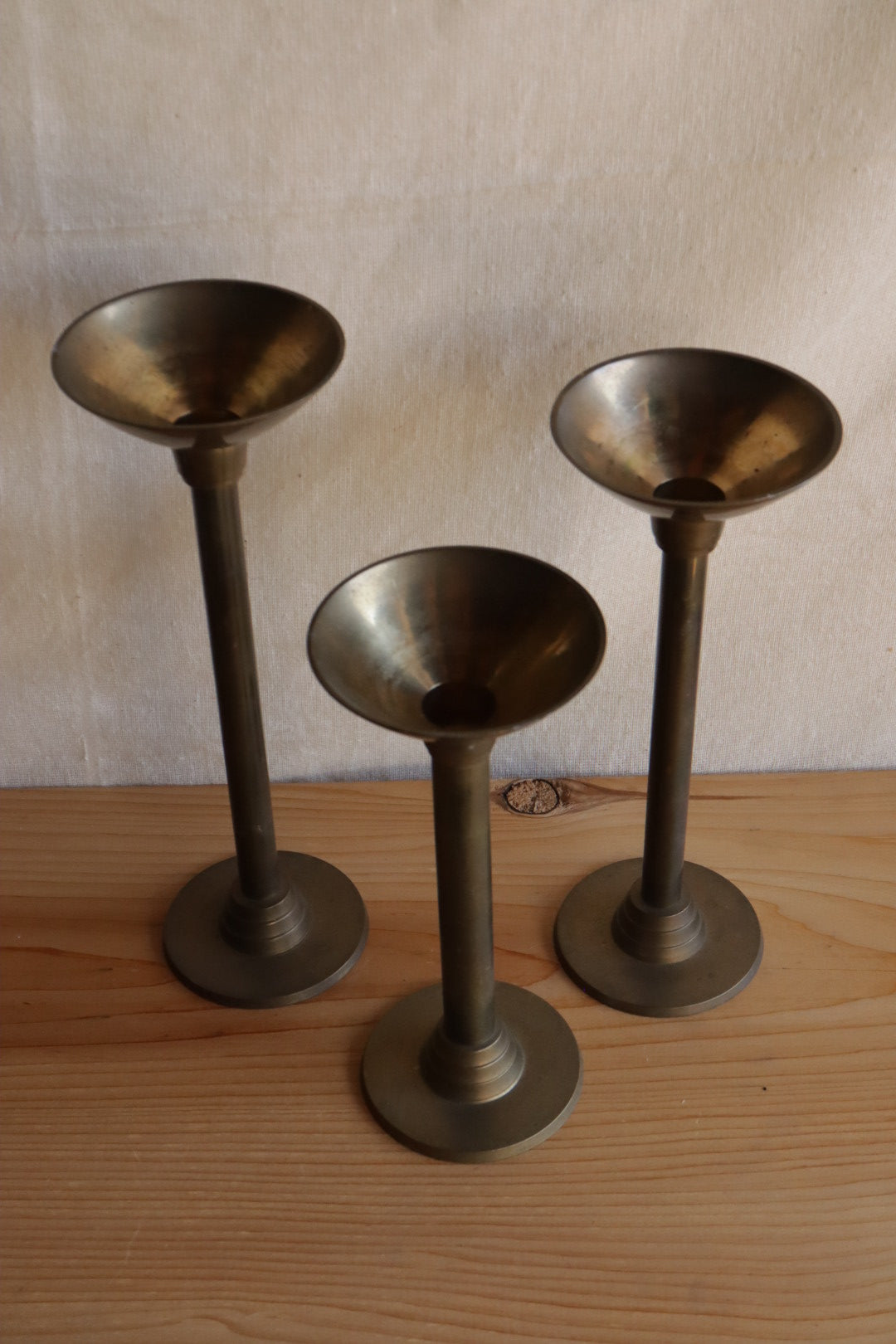 Brass candle holder trio