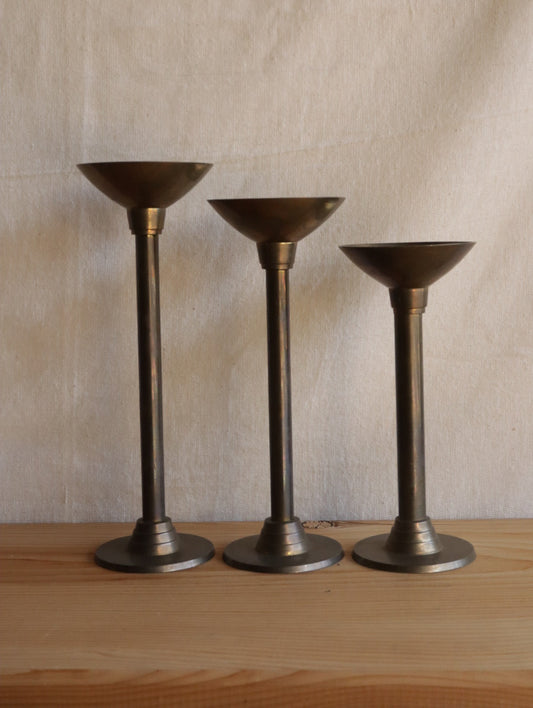 Brass candle holder trio