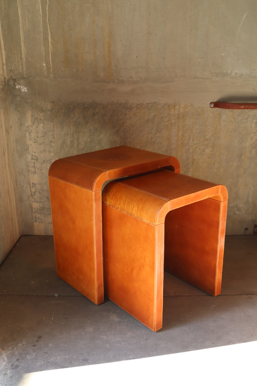 Leather waterfall nesting tables