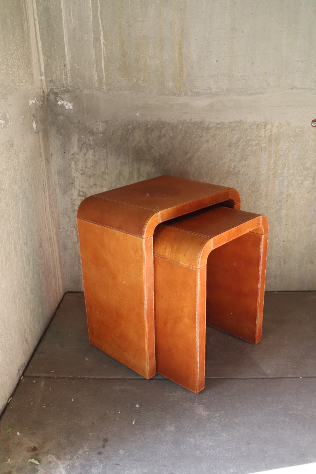 Leather waterfall nesting tables
