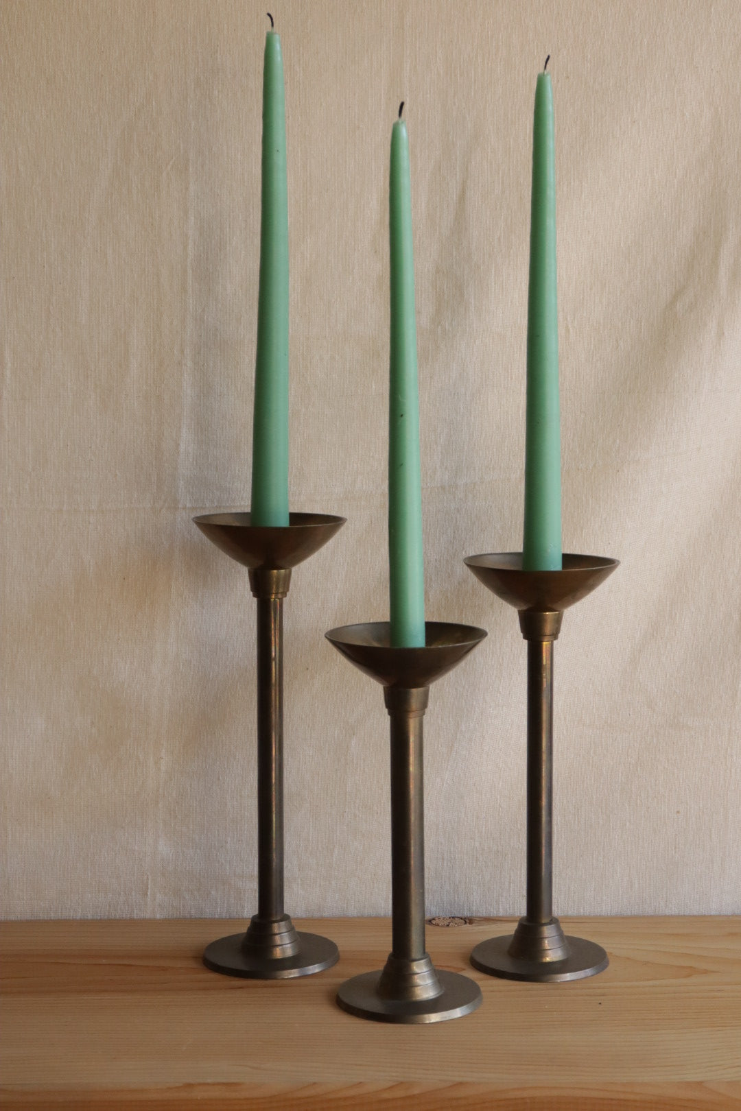 Brass candle holder trio