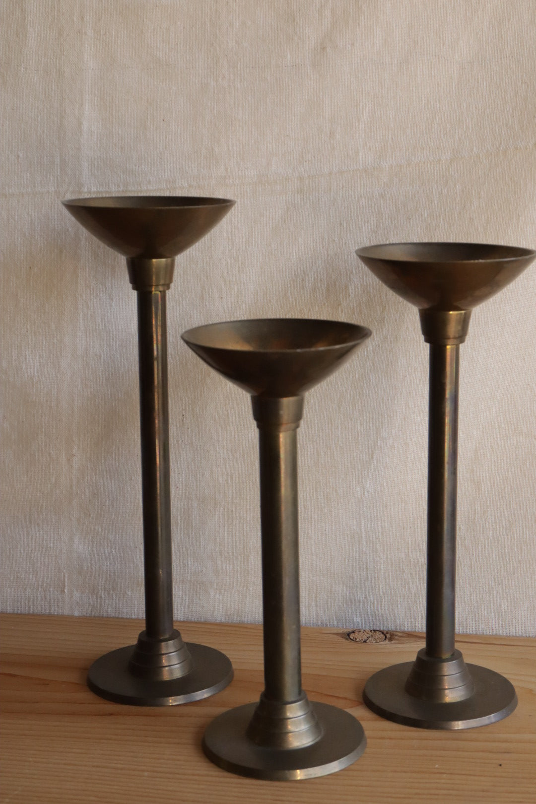 Brass candle holder trio