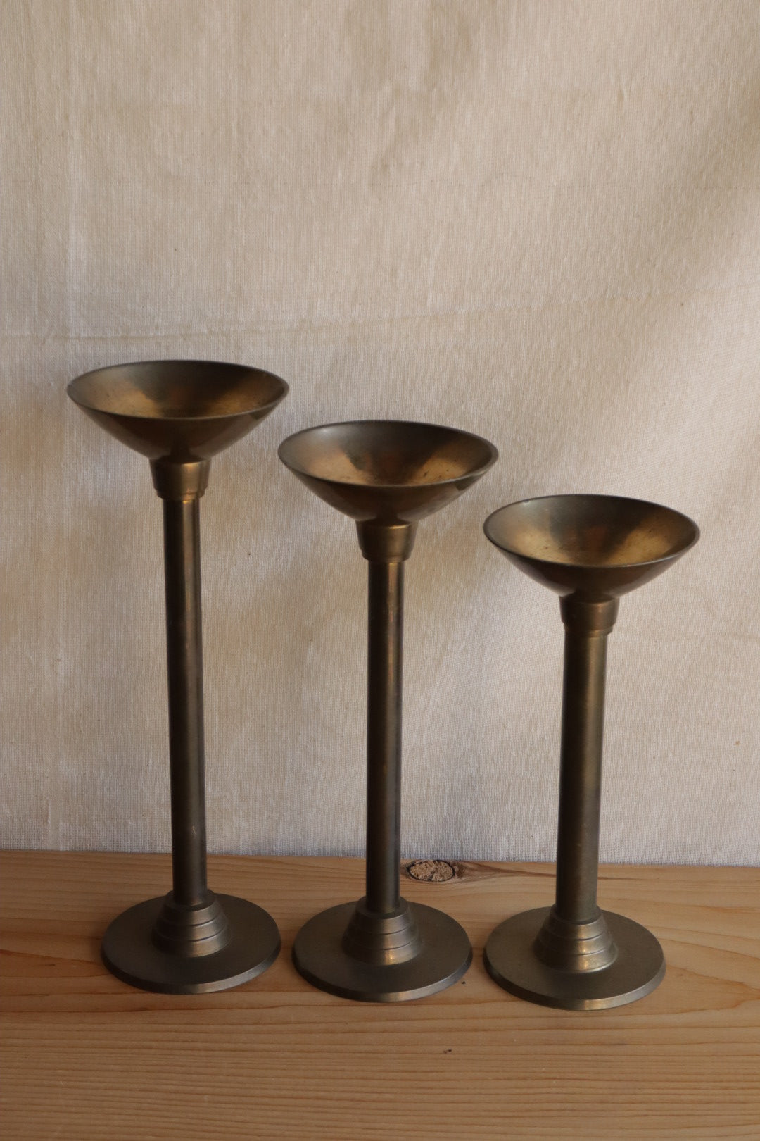 Brass candle holder trio