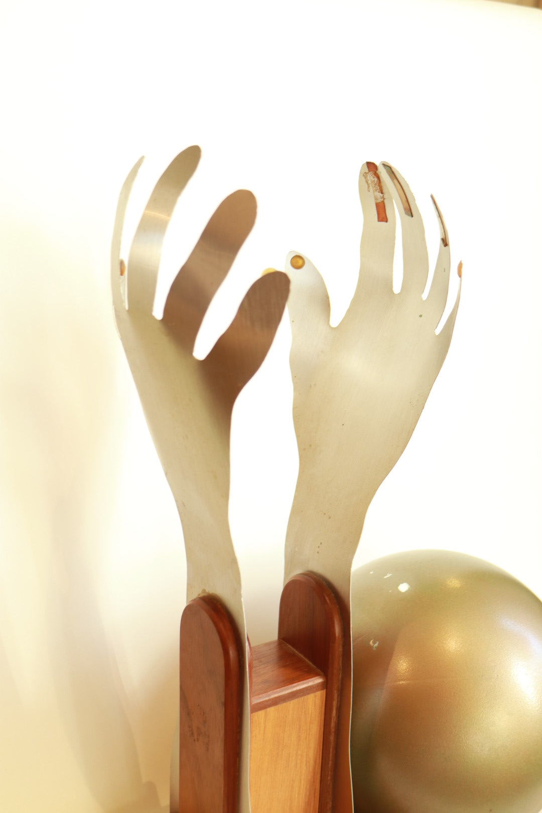 Handmade sculptural hands with sphere
